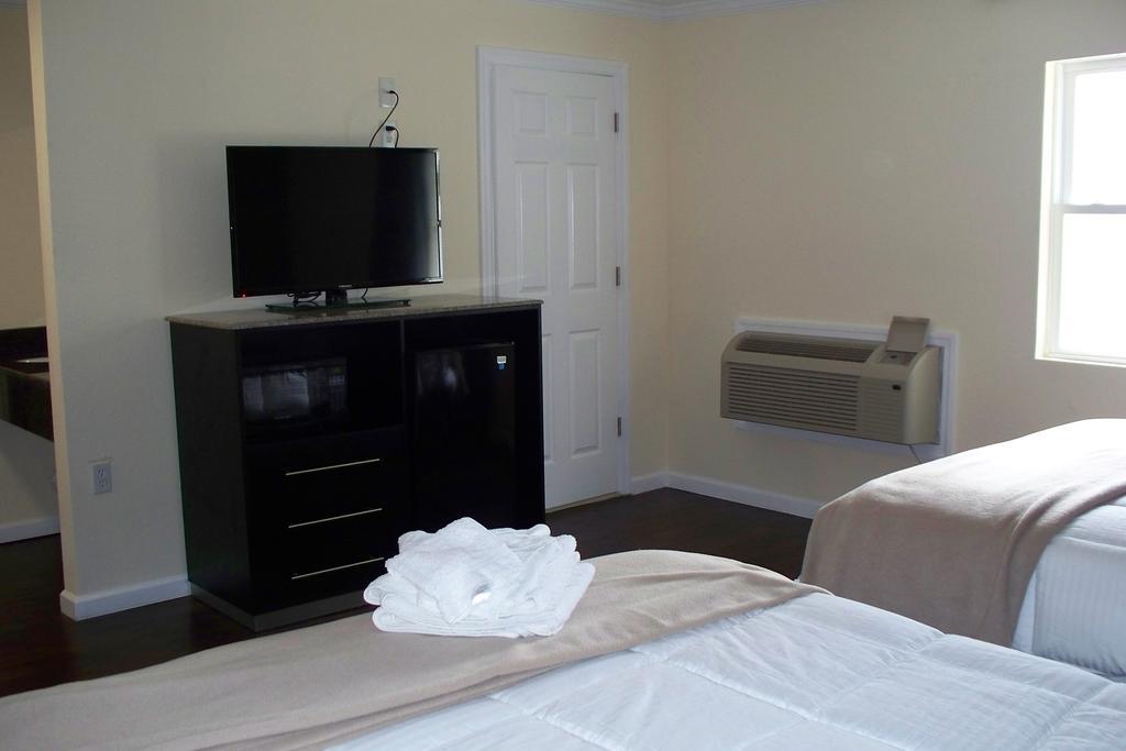 Budget Inn & Suites Wall Exterior photo