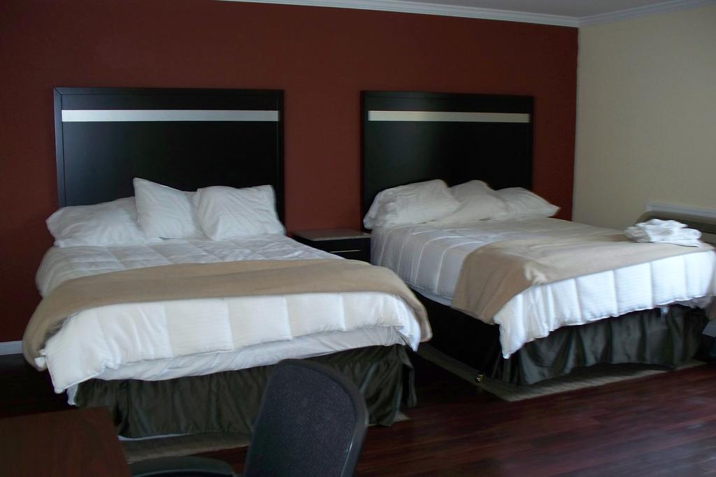 Budget Inn & Suites Wall Exterior photo