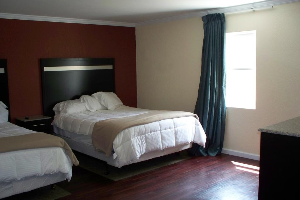Budget Inn & Suites Wall Exterior photo