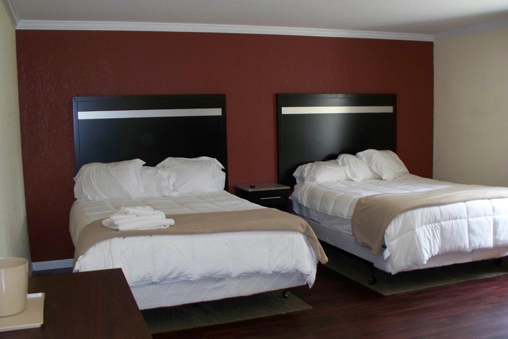 Budget Inn & Suites Wall Exterior photo